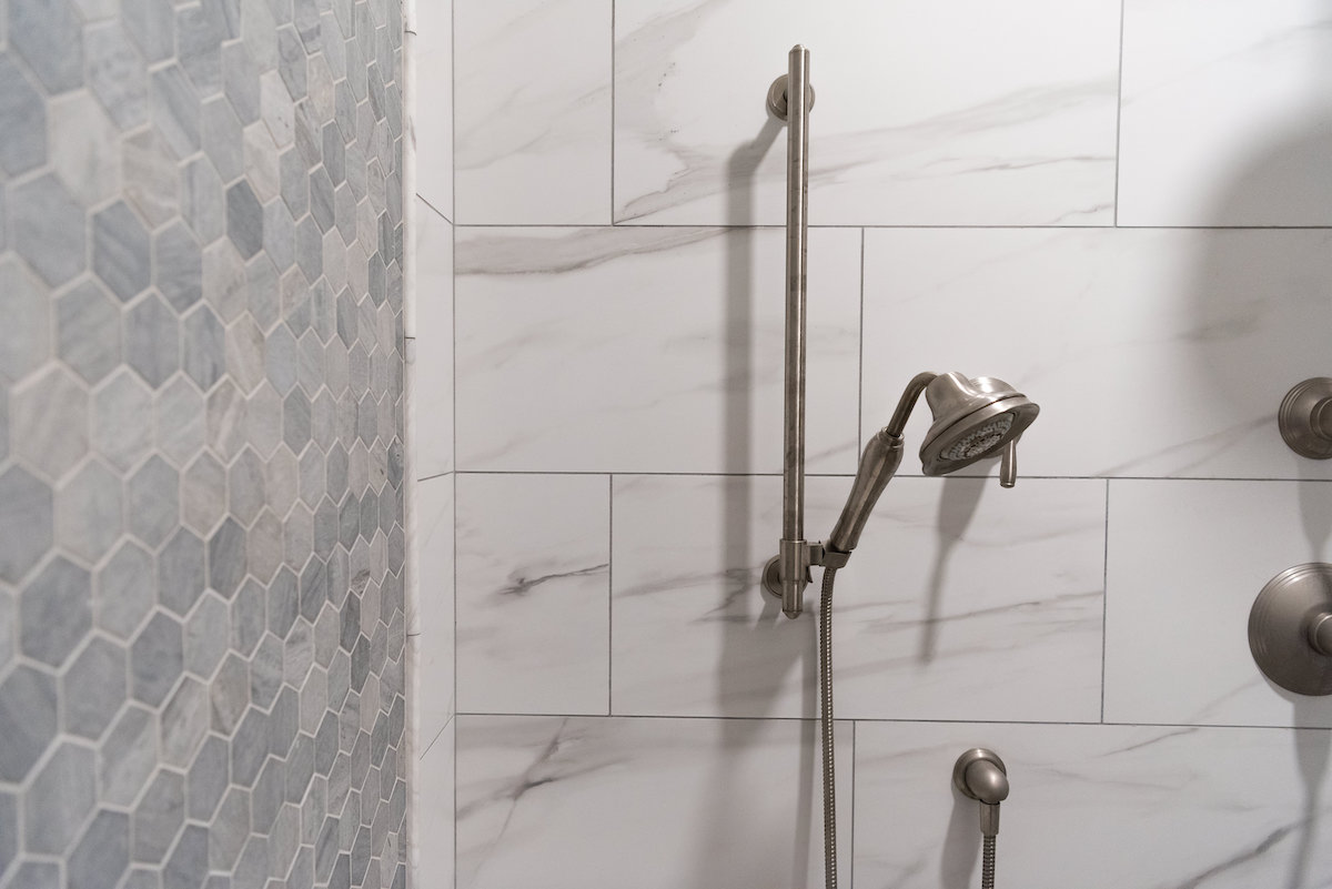 white-marble-shower-detail-stainless-steel-shower-head