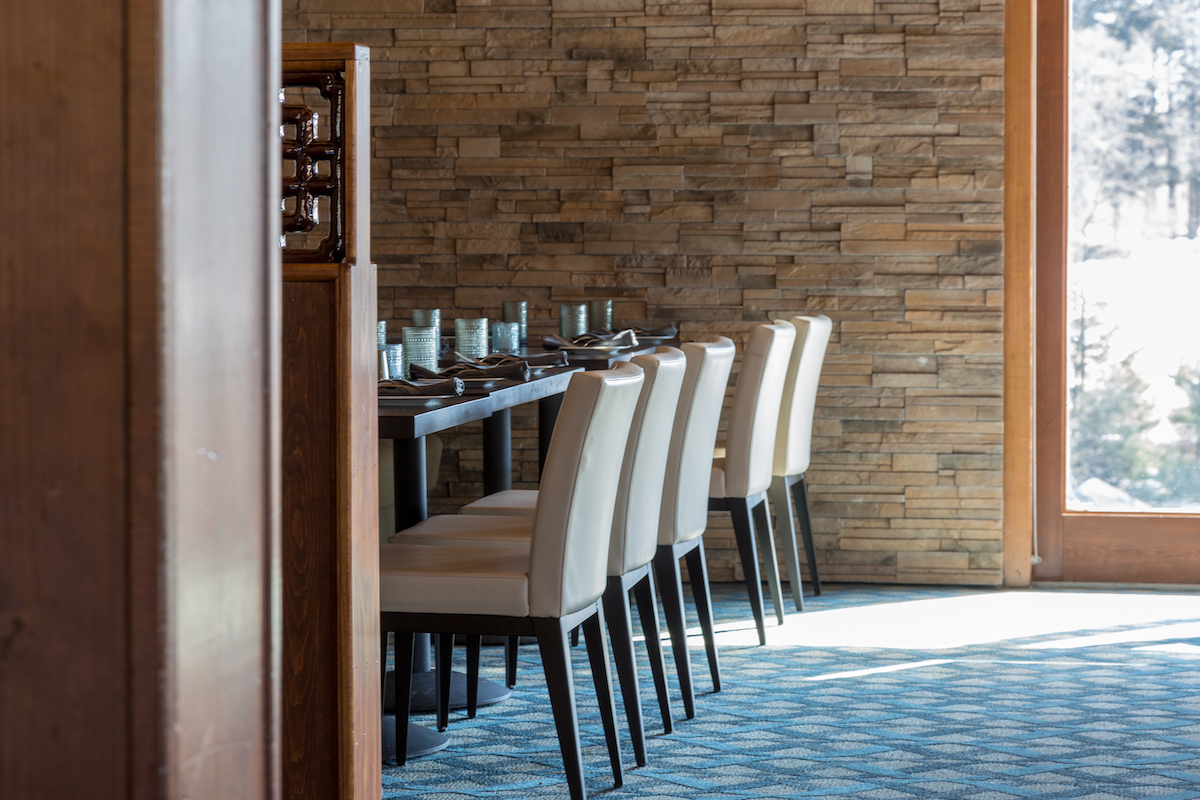 ns-interior-designs-commercial-designer-stone-wall-dining-room
