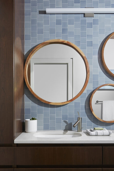 round-mirrors-bathroom-design-blue-tile-backsplash